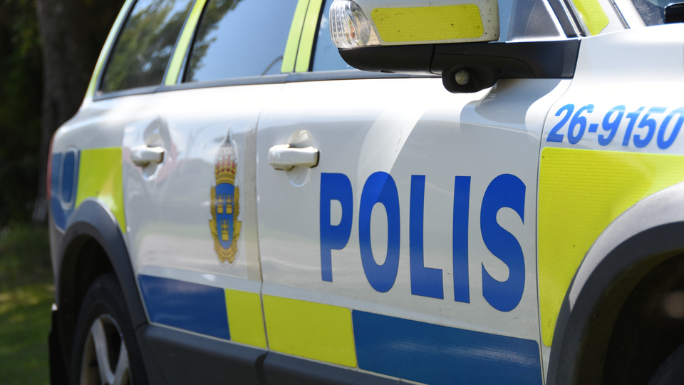 Sidan av en polisbil.